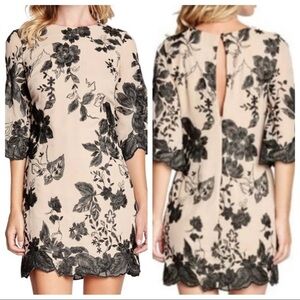 Dress the Population Paige tan mini dress with black floral embroidered Small